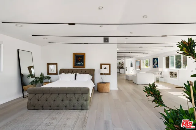 a bed room with furniture and a table