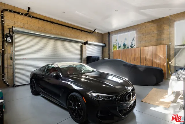 a view of a car parked in back of house