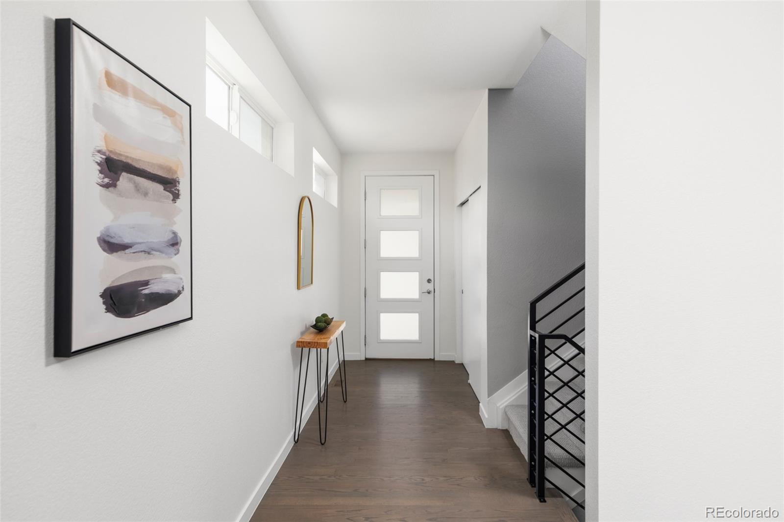 5230 Stuart Street Denver, CO 80212 - Photo 4 of 34 a view of a hallway with windows