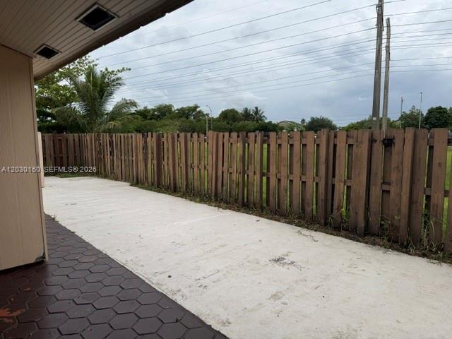11206 Southwest 125th Place, Unit 11206 Miami, FL 33186 - Photo 15 of 15 a view of wooden fence