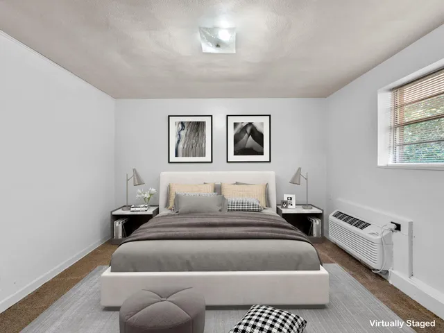 a bedroom with bed and window