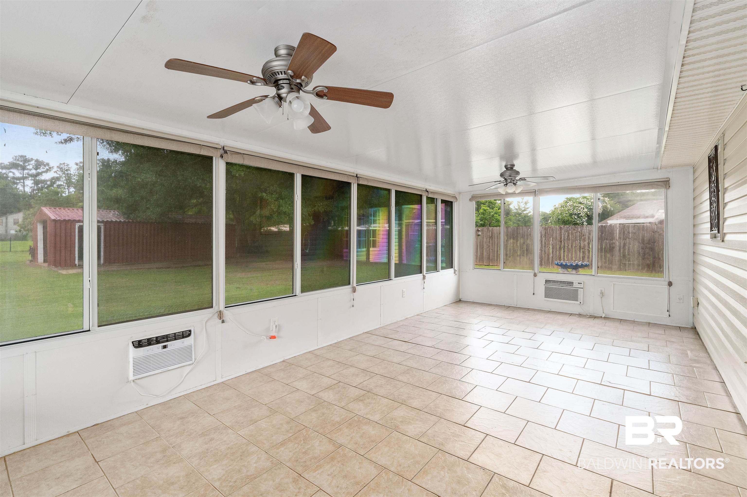 25779 Austin Road Daphne, AL 36526 - Photo 11 of 30 Unfurnished sunroom featuring a ceiling fan and a wall mounted air conditioner