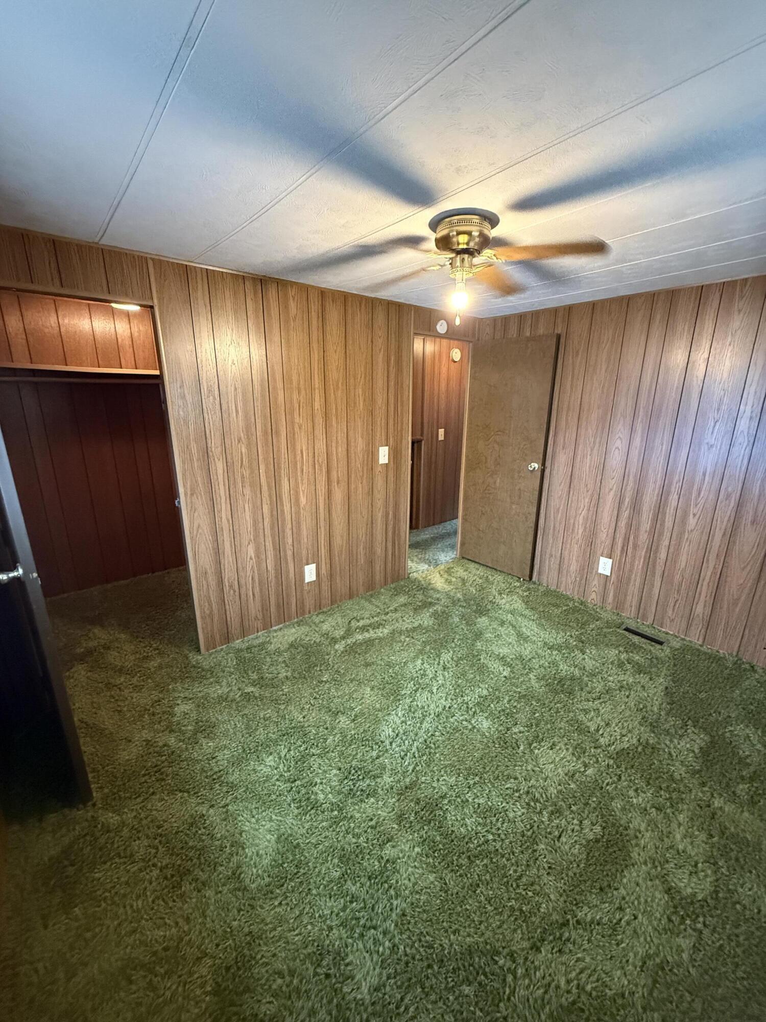 421 Stevens Road, Unit 20 Eagle Point, OR 97524 - Photo 14 of 22 an empty room with a window and a fan