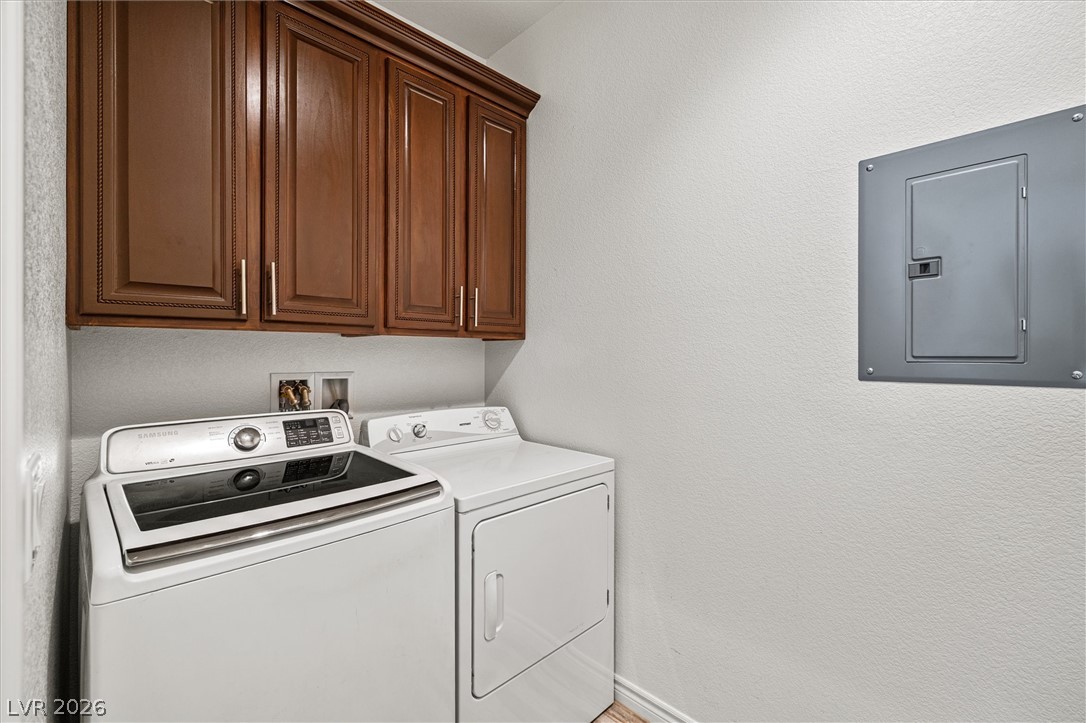 6720 Stubblefield Drive Pahrump, NV 89061 - Photo 25 of 51 Ample storage options meet practical utility in this dedicated laundry space.