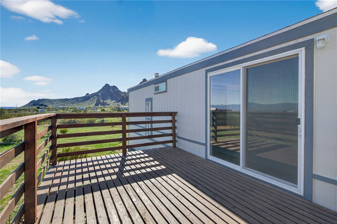 2294 South Dragoon Road Golden Valley, AZ 86413 - Photo 11 of 35 Wooden terrace featuring a mountain view