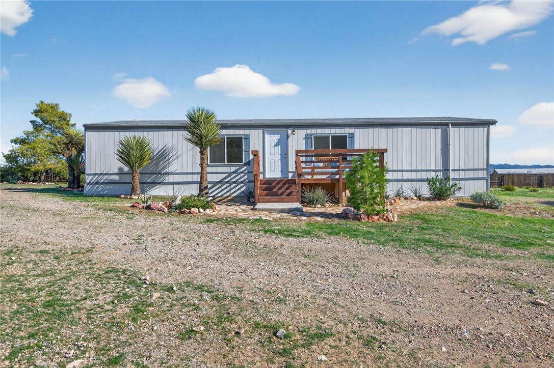 2294 South Dragoon Road Golden Valley, AZ 86413 - Photo 2 of 35 Manufactured / mobile home featuring a wooden deck
