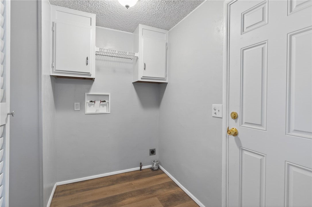 2294 South Dragoon Road Golden Valley, AZ 86413 - Photo 26 of 35 Laundry room featuring finished floors, hookup for a washing machine, cabinet space, and electric dryer hookup