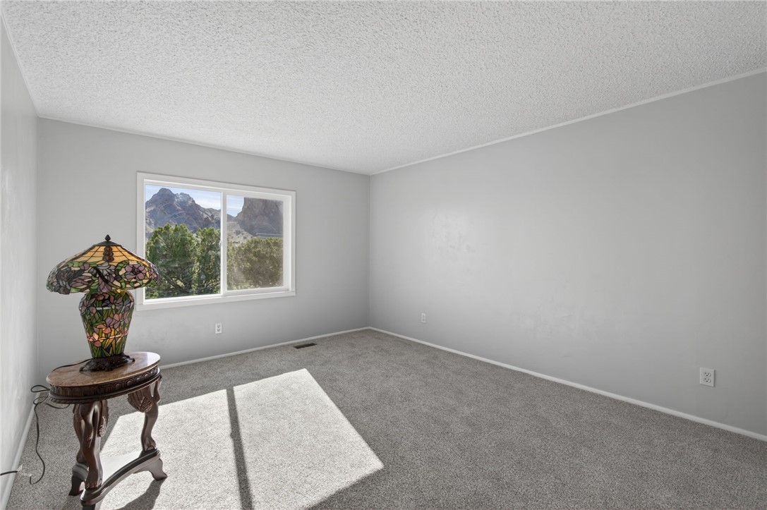 2294 South Dragoon Road Golden Valley, AZ 86413 - Photo 28 of 35 Guest Bedroom 1 featuring new carpet floors