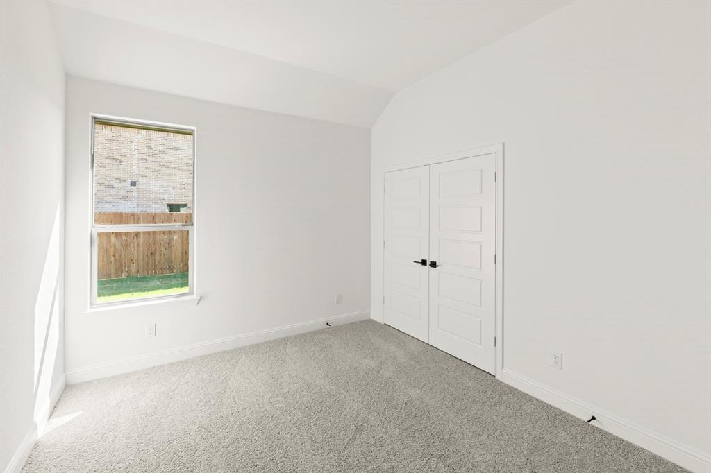 610 Tenor Drive Forney, TX 75126 - Photo 21 of 30 an empty room with a window