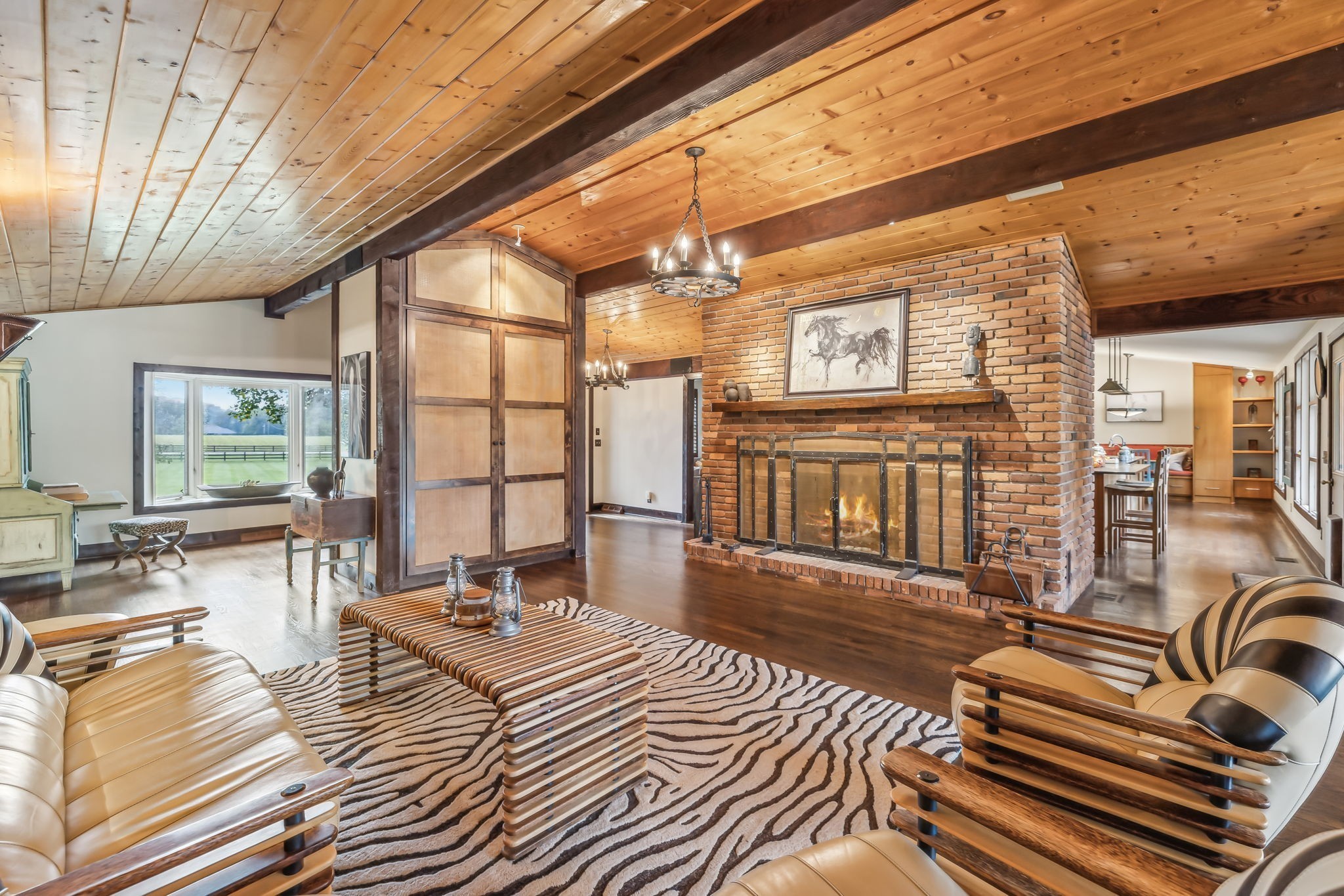 2864 Sawyer Bend Road Nashville, TN 37221 - Photo 17 of 94 a living room with furniture a flat screen tv and large windows