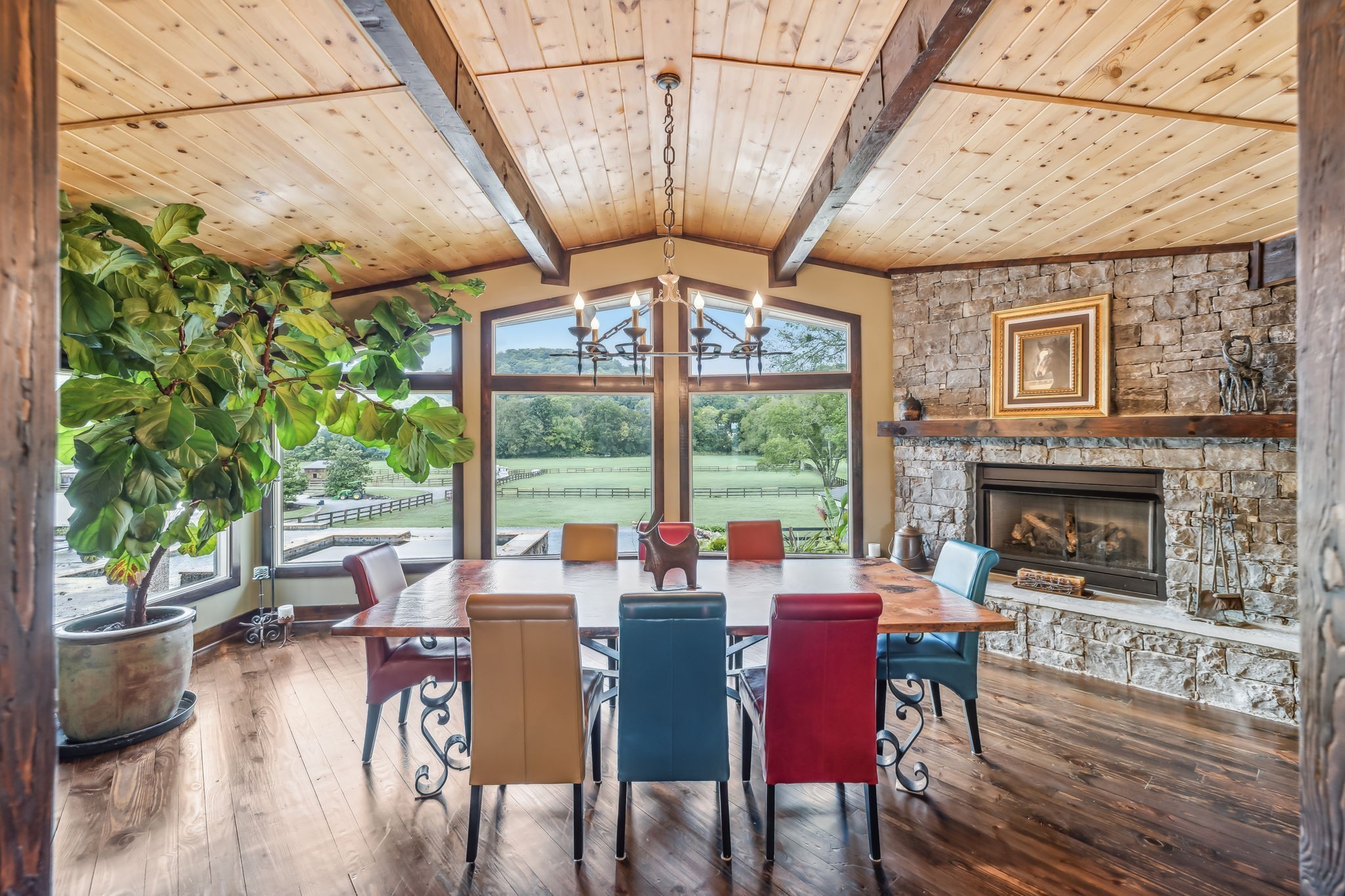 2864 Sawyer Bend Road Nashville, TN 37221 - Photo 20 of 94 a dining room with furniture a fireplace and wooden floor