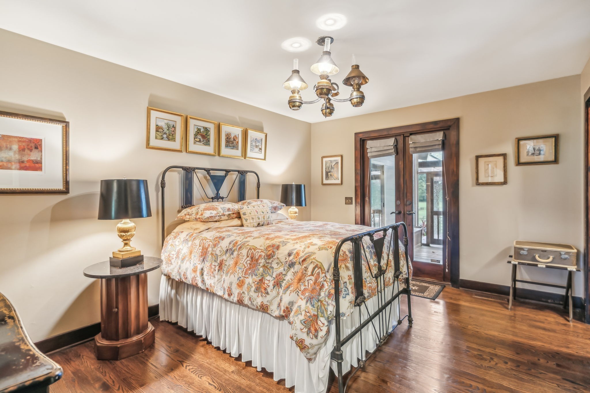 2864 Sawyer Bend Road Nashville, TN 37221 - Photo 41 of 94 a spacious bedroom with a bed and a chandelier