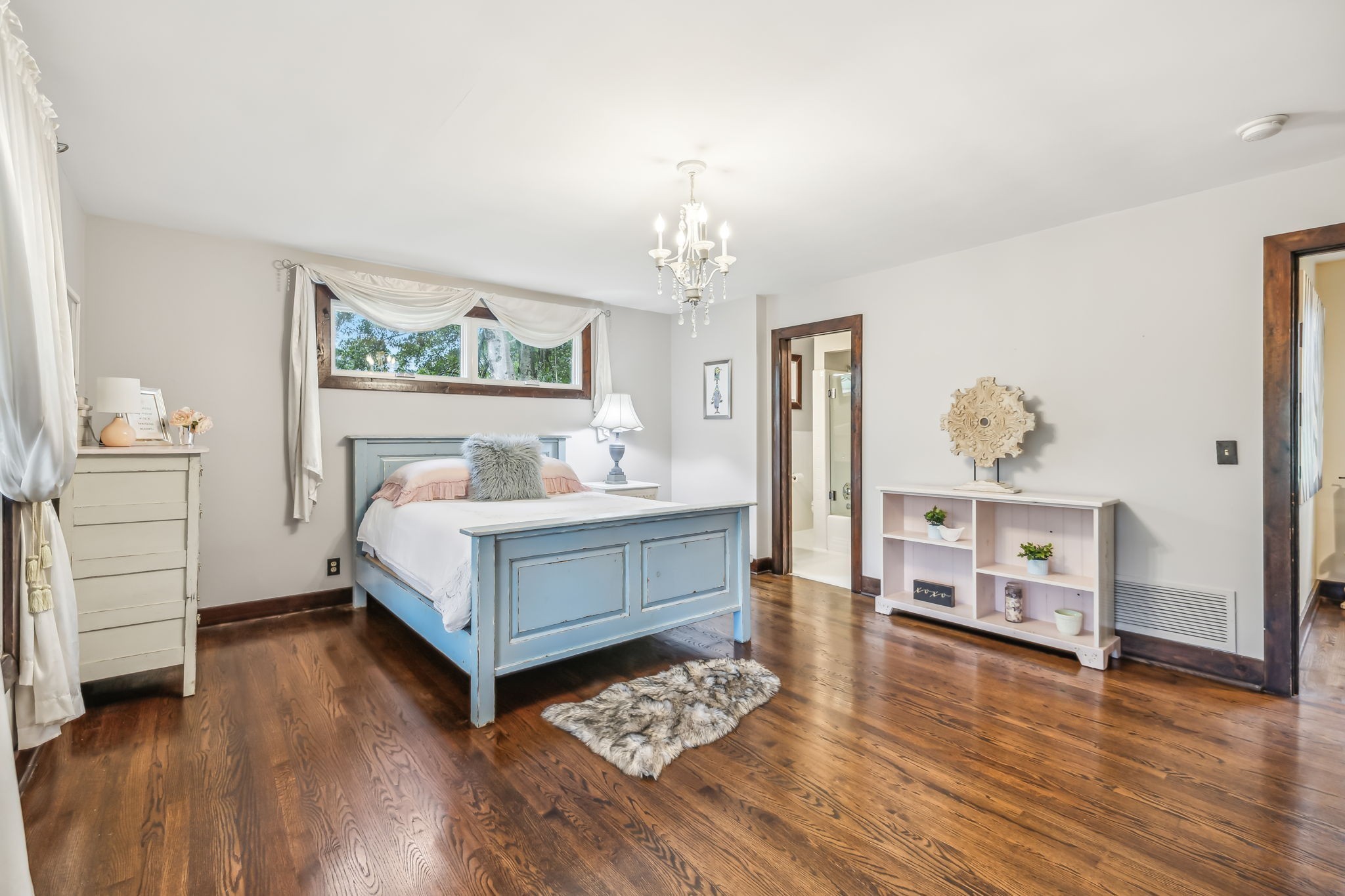 2864 Sawyer Bend Road Nashville, TN 37221 - Photo 45 of 94 a bedroom with a bed and a chandelier