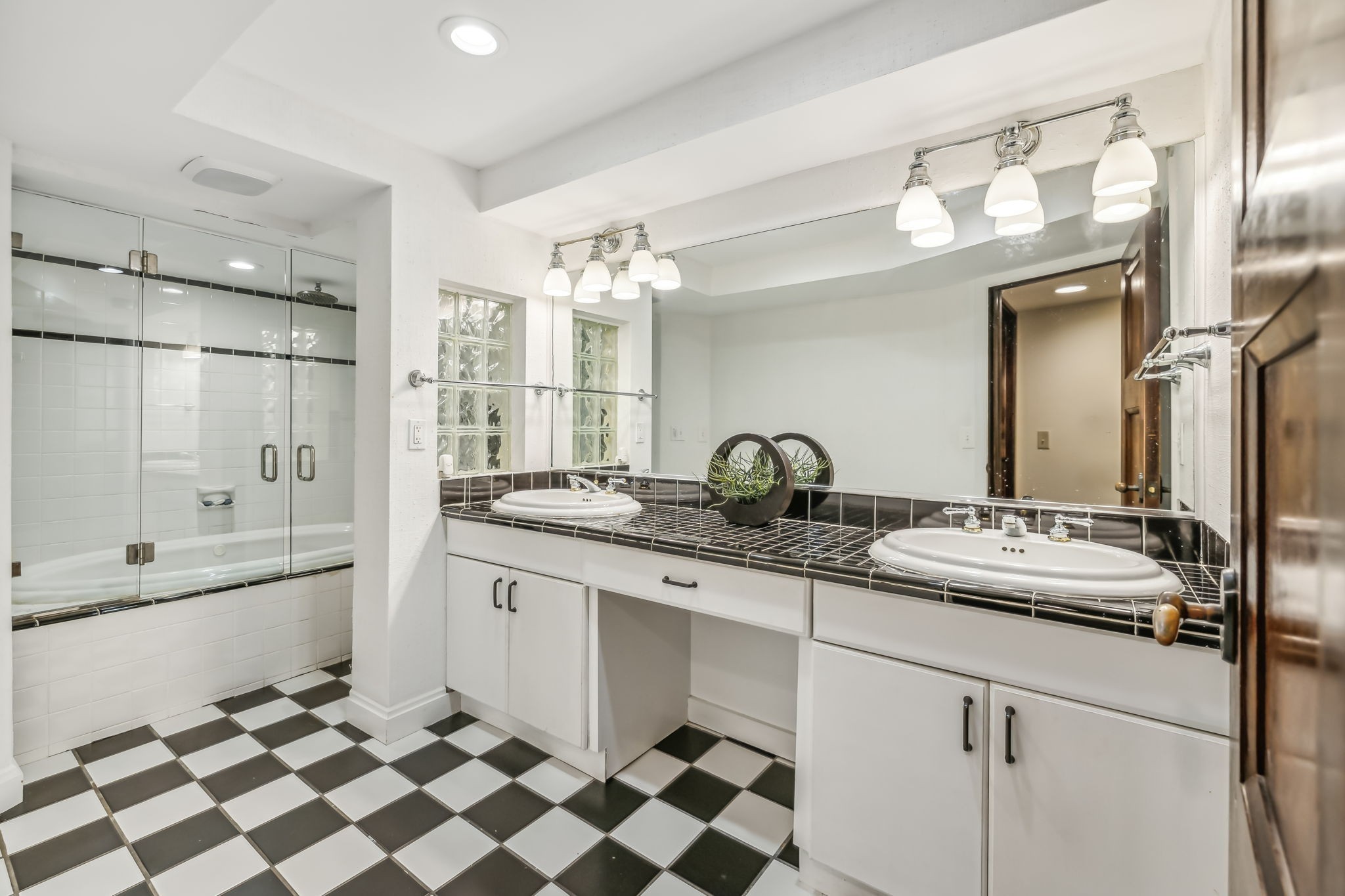 2864 Sawyer Bend Road Nashville, TN 37221 - Photo 63 of 94 a bathroom with a sink a large mirror and a shower