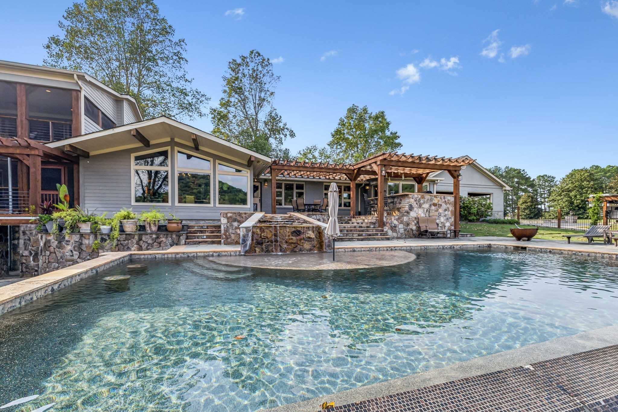 2864 Sawyer Bend Road Nashville, TN 37221 - Photo 74 of 94 a front view of a house with swimming pool having outdoor seating