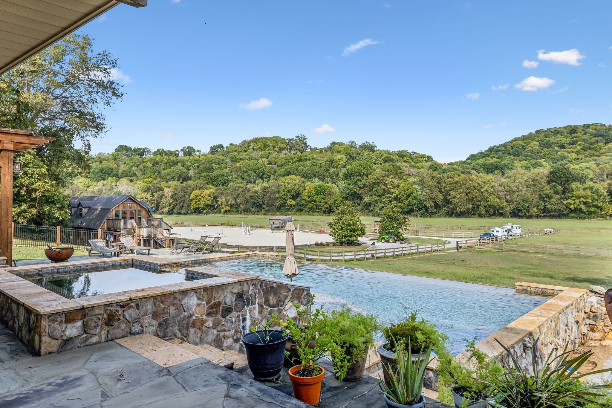 2864 Sawyer Bend Road Nashville, TN 37221 - Photo 75 of 94 a view of a swimming pool with a patio and a garden