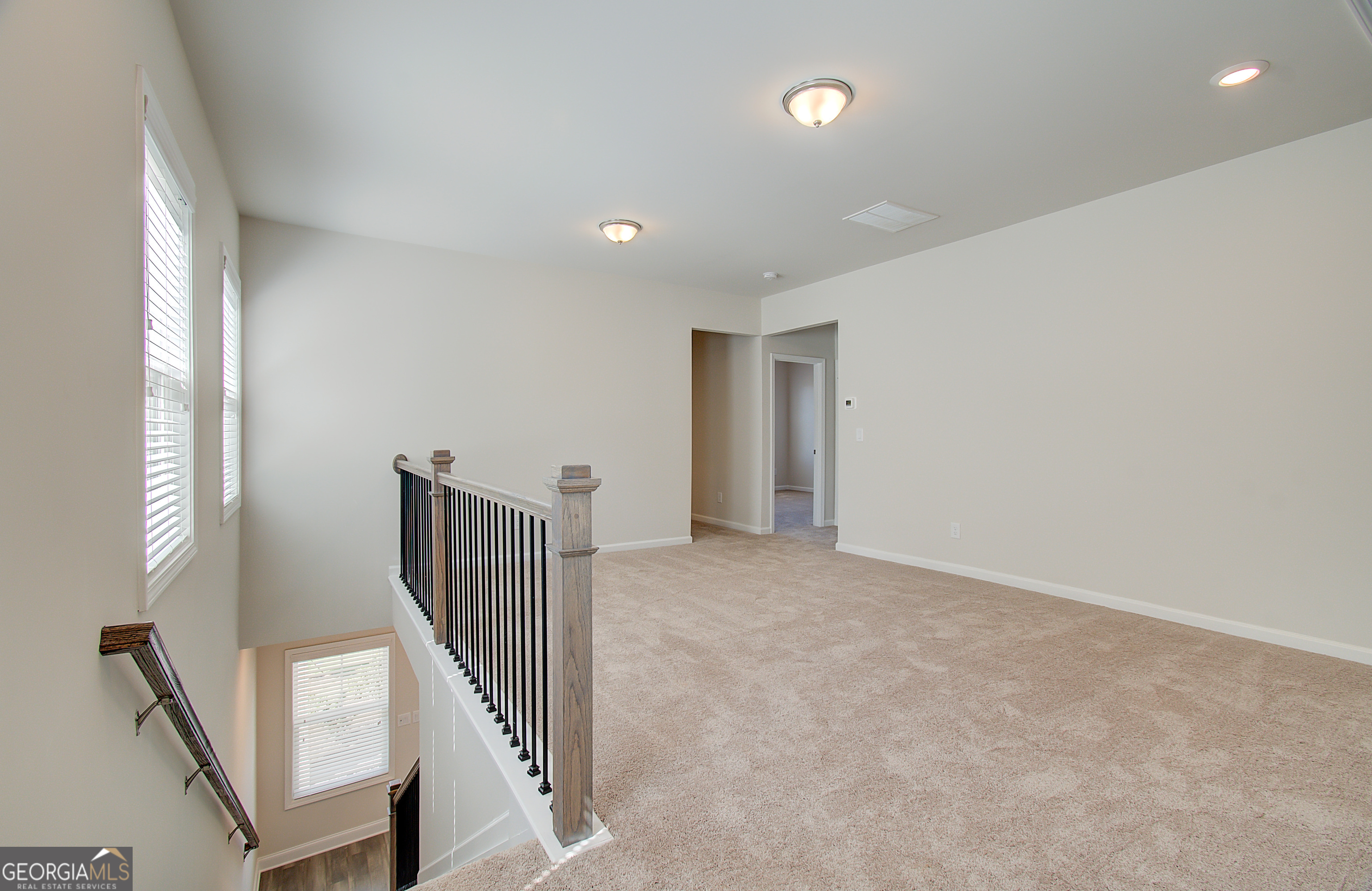 71 Avian Way, Unit 17B Auburn, GA 30011 - Photo 15 of 32 a view of an entryway with wooden floor