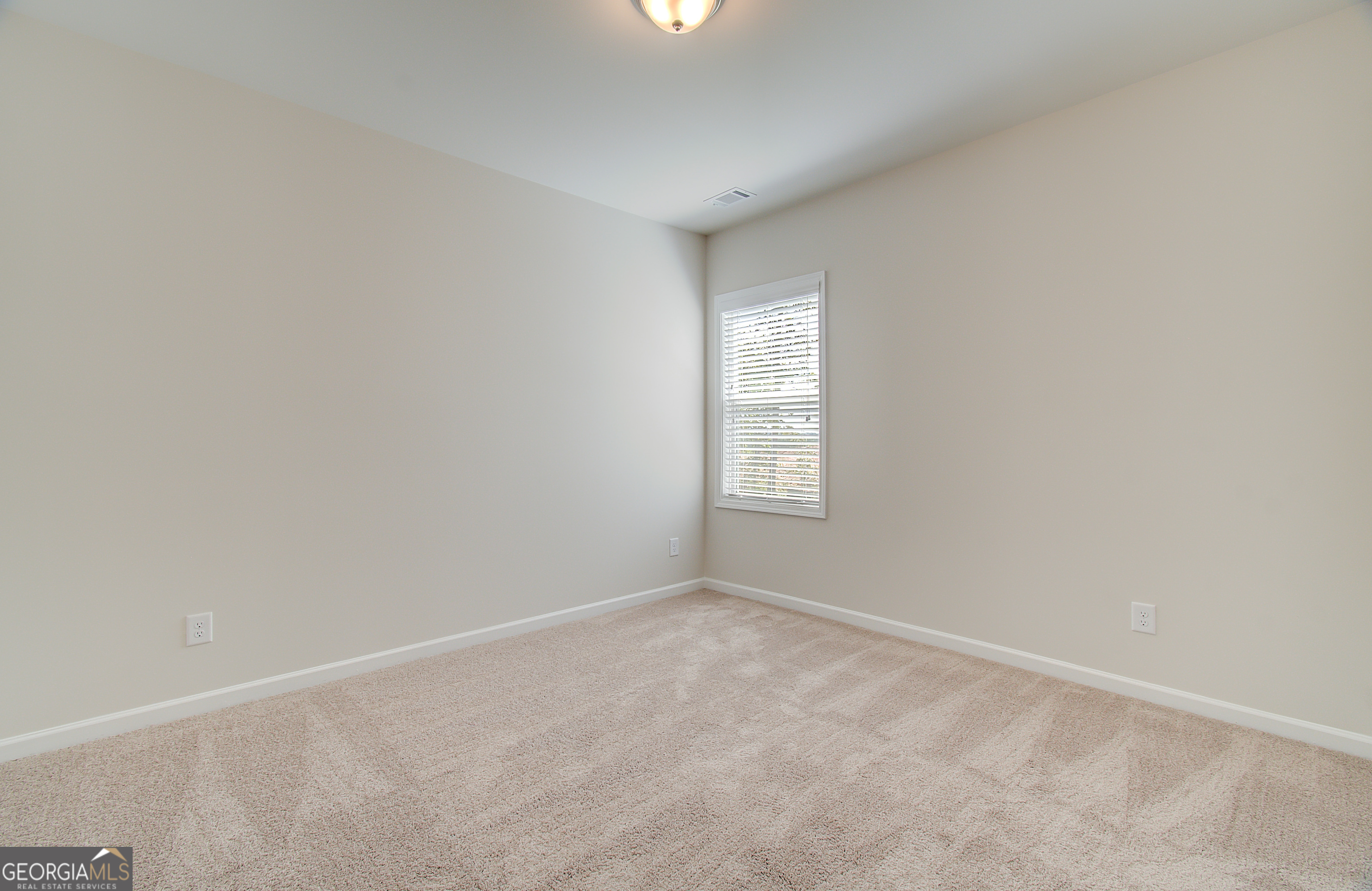 71 Avian Way, Unit 17B Auburn, GA 30011 - Photo 16 of 32 an empty room with windows