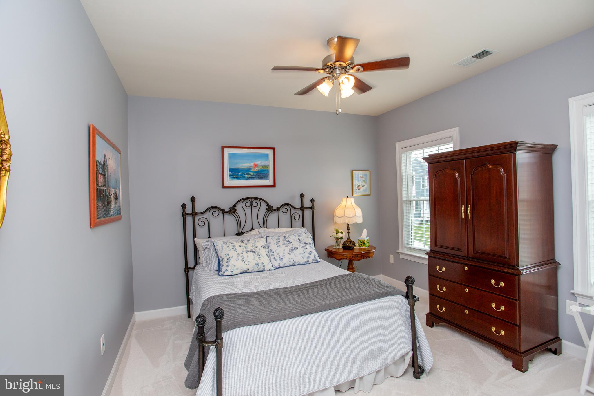 4682 Plough Tavern Road Doylestown, PA 18902 - Photo 28 of 42 a bedroom with a bed and a mirror