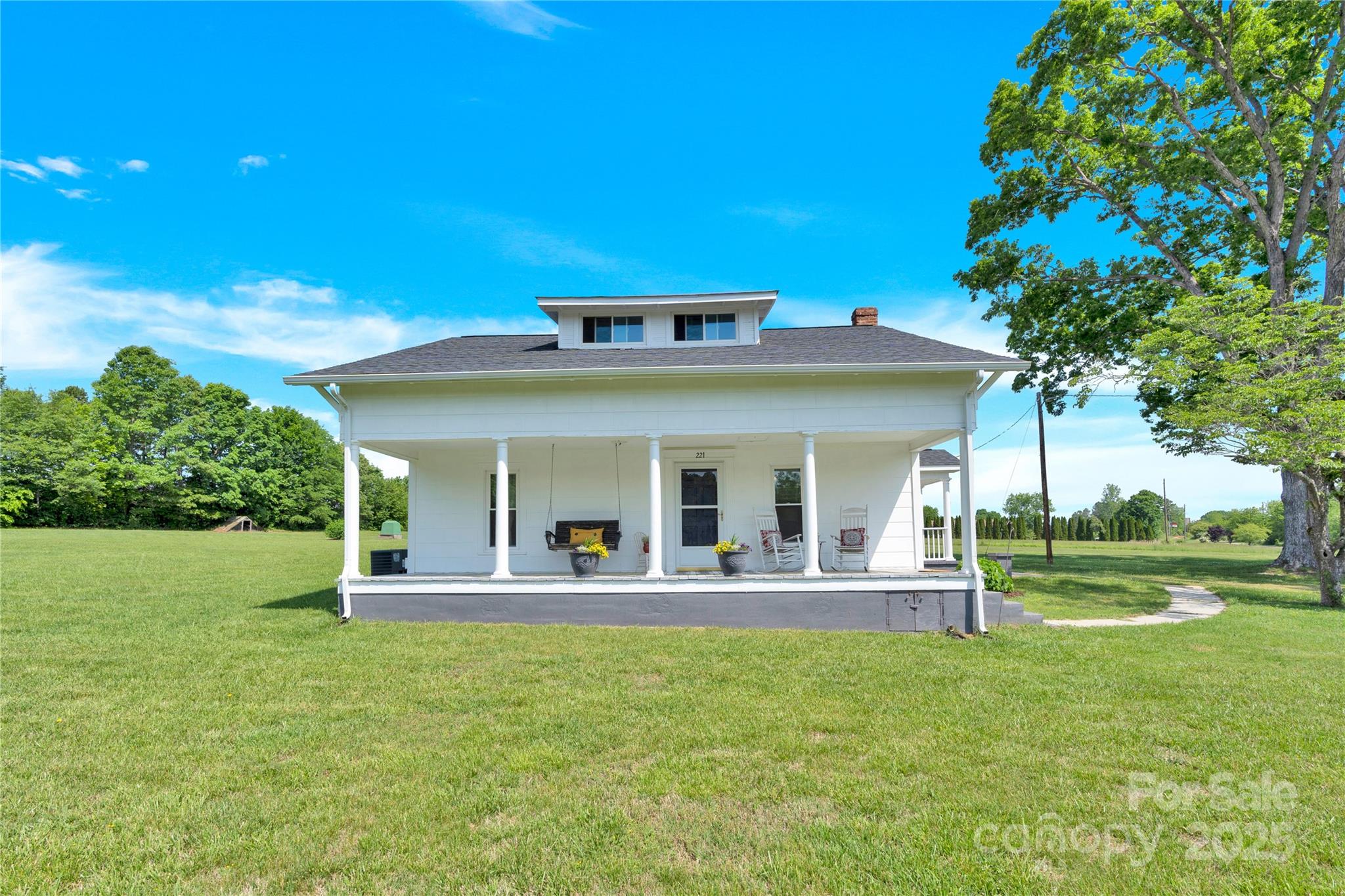 221 Abner Road Stony Point, NC 28678 - Photo 3 of 40 a view of a house with a backyard porch and sitting area