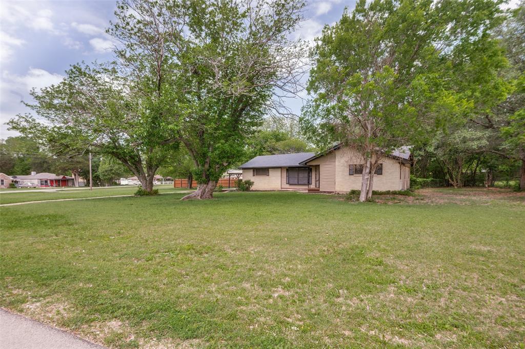 1533 East Springcrest Circle Lancaster, TX 75134 - Photo 2 of 25 Expansive front lawn with mature shade trees