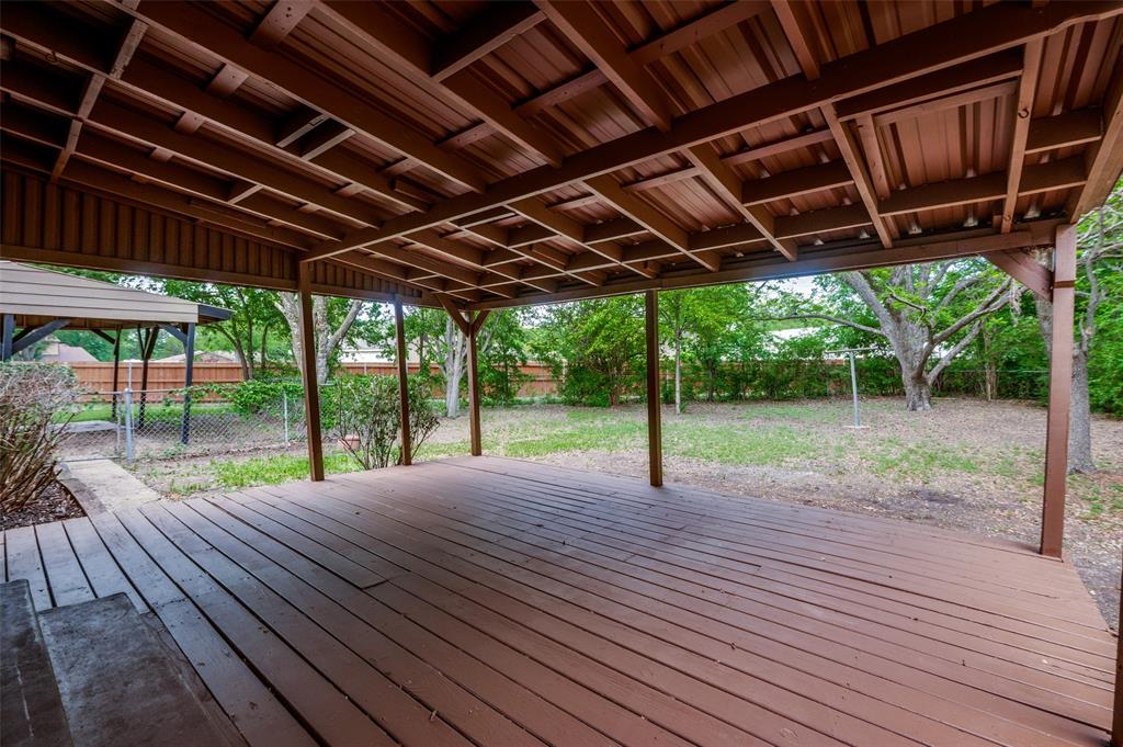 1533 East Springcrest Circle Lancaster, TX 75134 - Photo 23 of 25 Expansive outdoor deck featuring a rich brown finish and a slatted wood ceiling