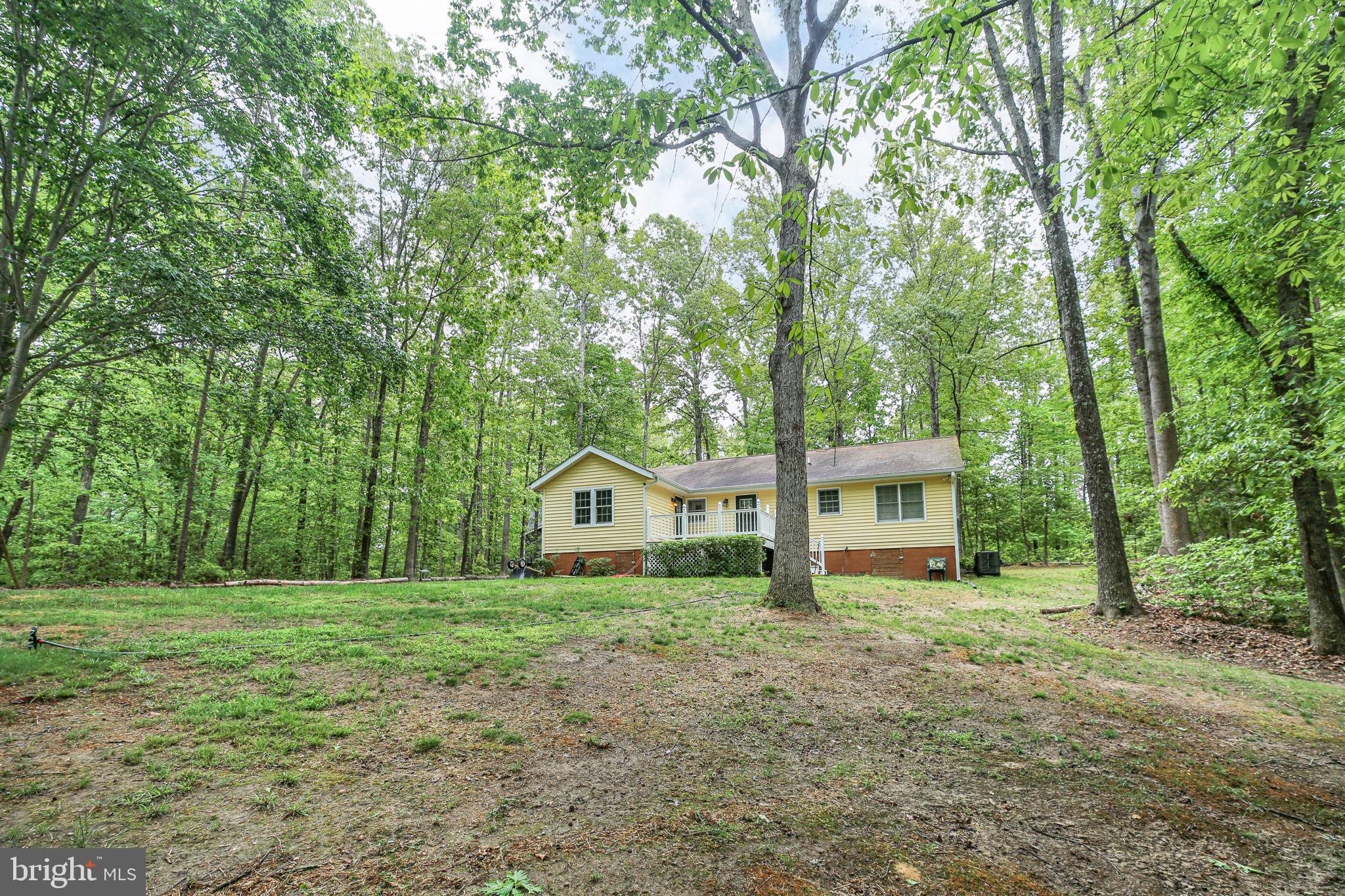 143 Cranes Corner Road Fredericksburg, VA 22405 - Photo 20 of 26 Serene home nestled in lush greenery.