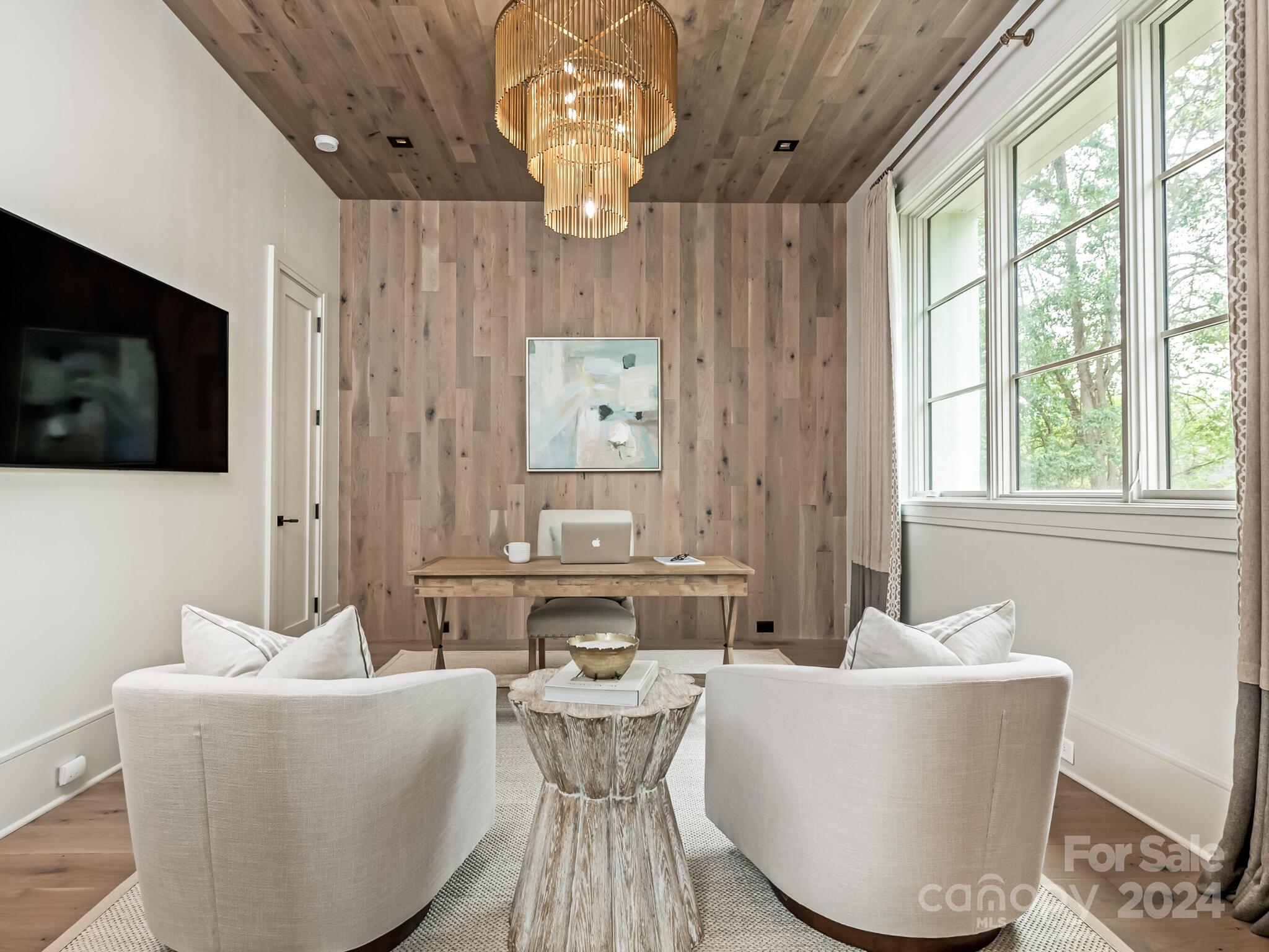 2717 Westfield Road Charlotte, NC 28209 - Photo 12 of 32 a living room with furniture a flat screen tv and a large window