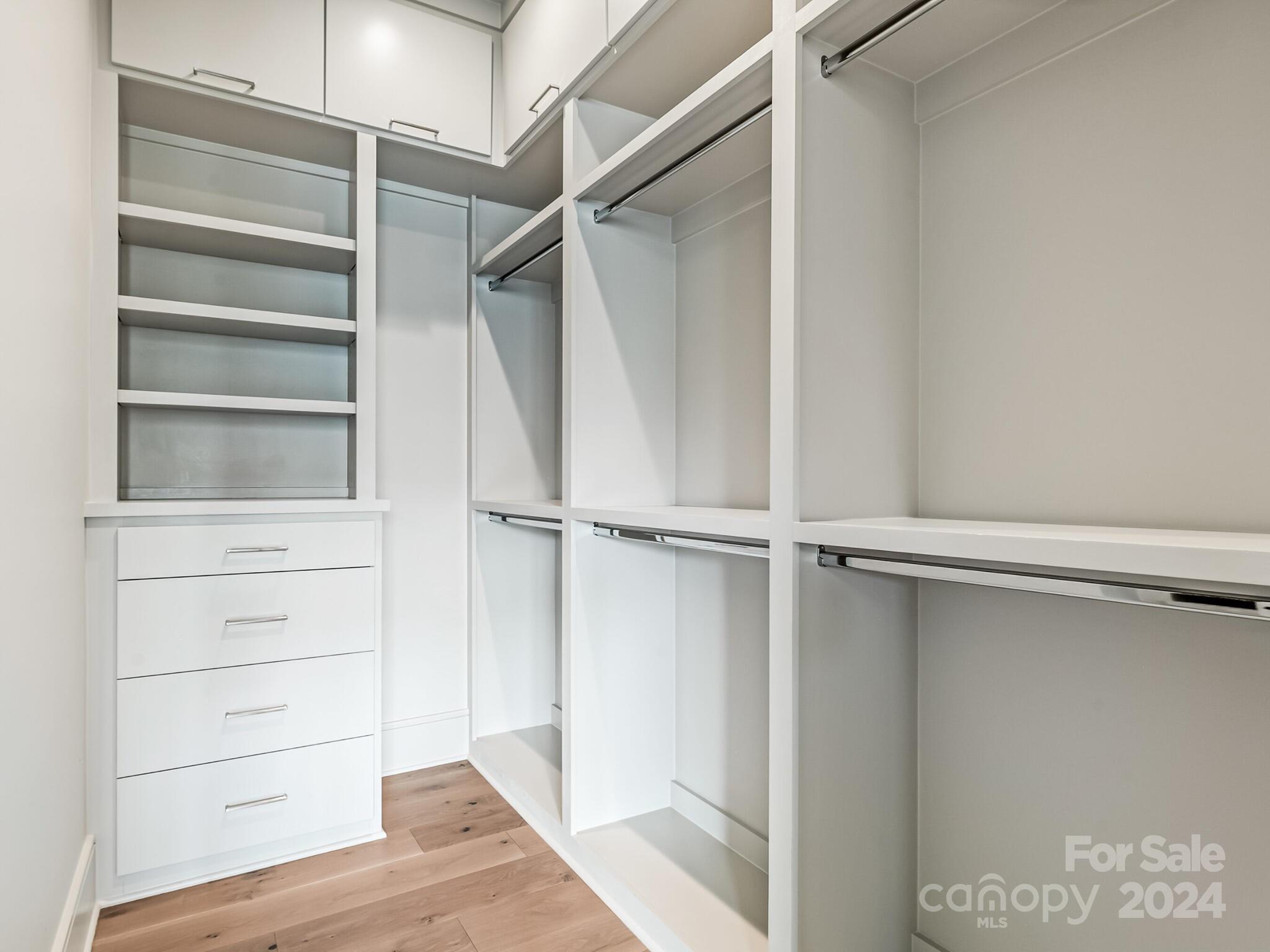 2717 Westfield Road Charlotte, NC 28209 - Photo 21 of 32 a view of walk in closet with empty racks