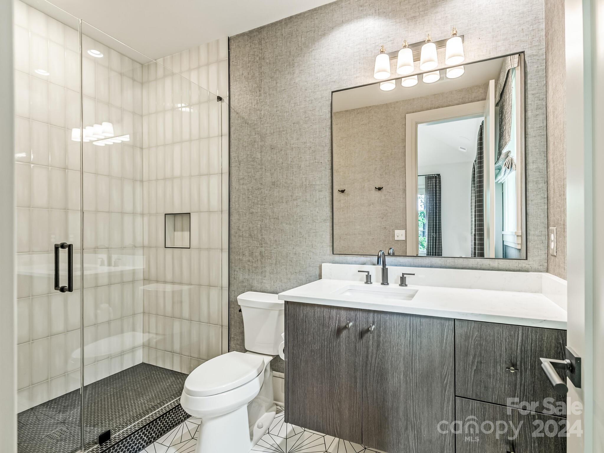 2717 Westfield Road Charlotte, NC 28209 - Photo 26 of 32 a bathroom with a sink toilet and shower