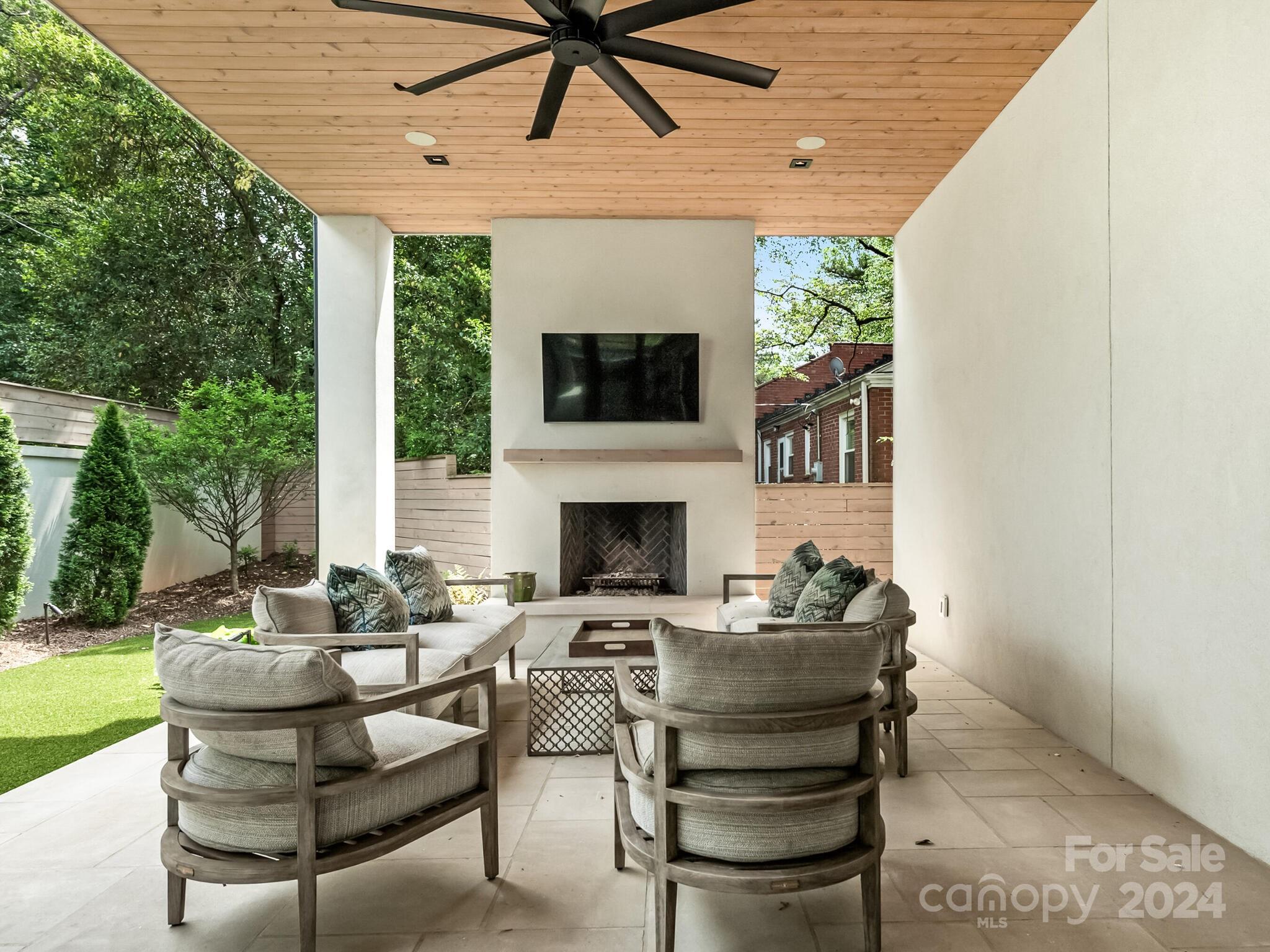 2717 Westfield Road Charlotte, NC 28209 - Photo 29 of 32 a outdoor space with patio fireplace couches and a potted plant