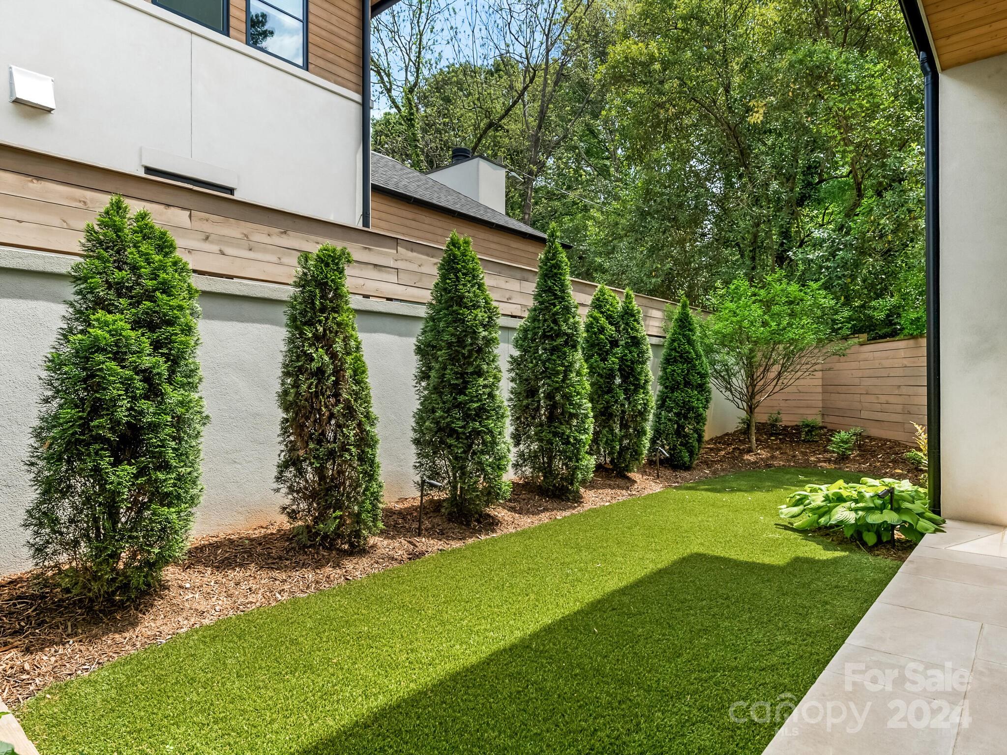 2717 Westfield Road Charlotte, NC 28209 - Photo 30 of 32 a backyard of a house with lots of green space