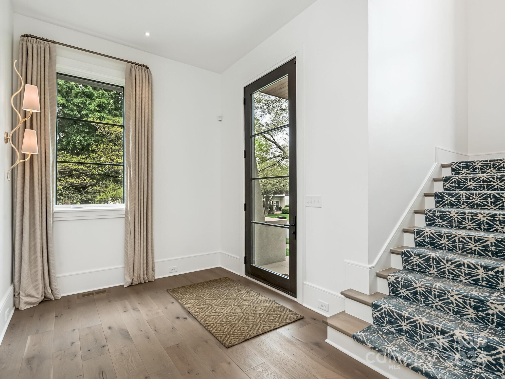 2717 Westfield Road Charlotte, NC 28209 - Photo 4 of 32 an entryway with a window and wooden floor
