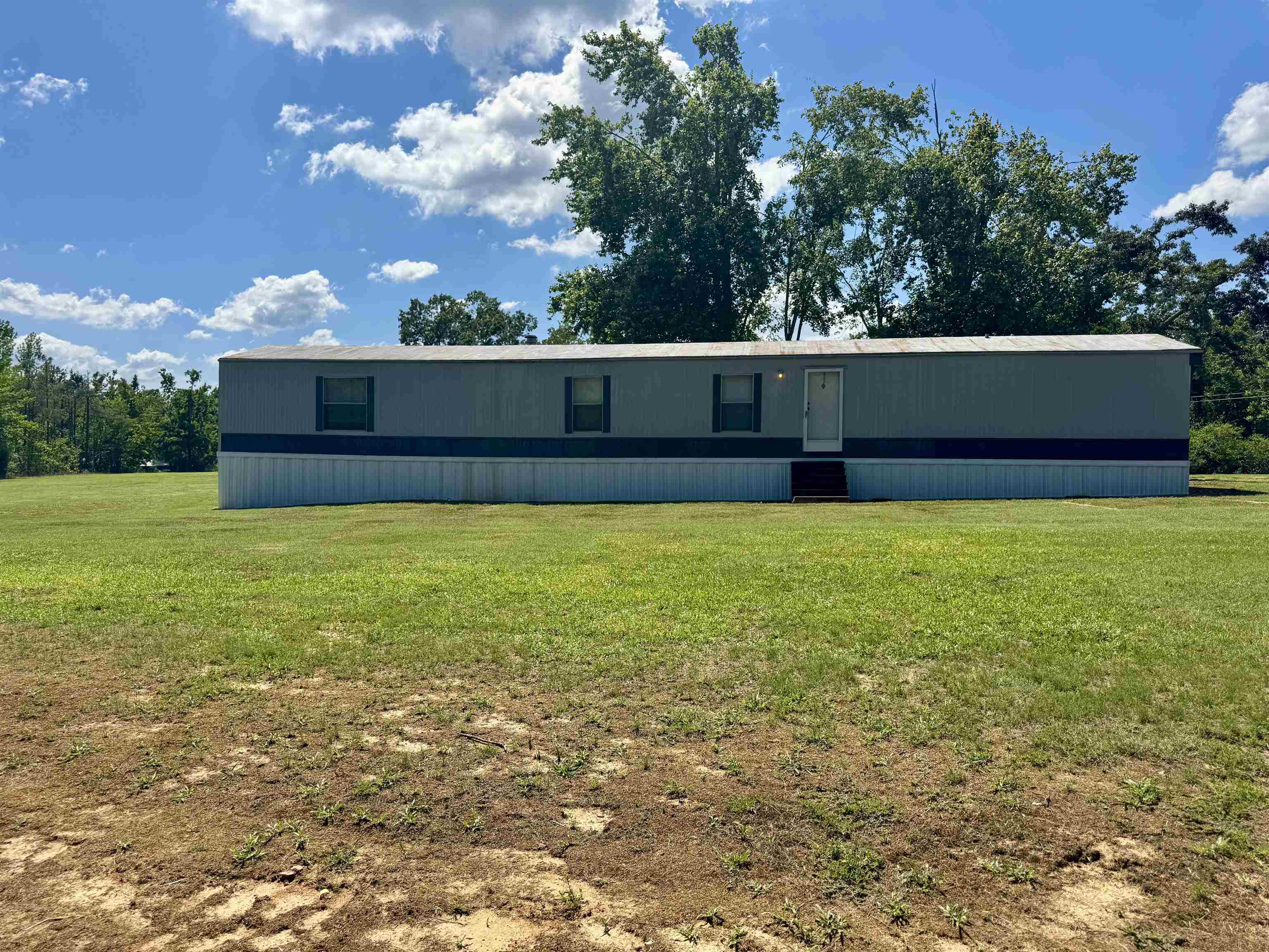 2511 Watkins Road Michie, TN 38357 - Photo 2 of 40 Longitudinal manufactured home with a light gray and dark gray exterior