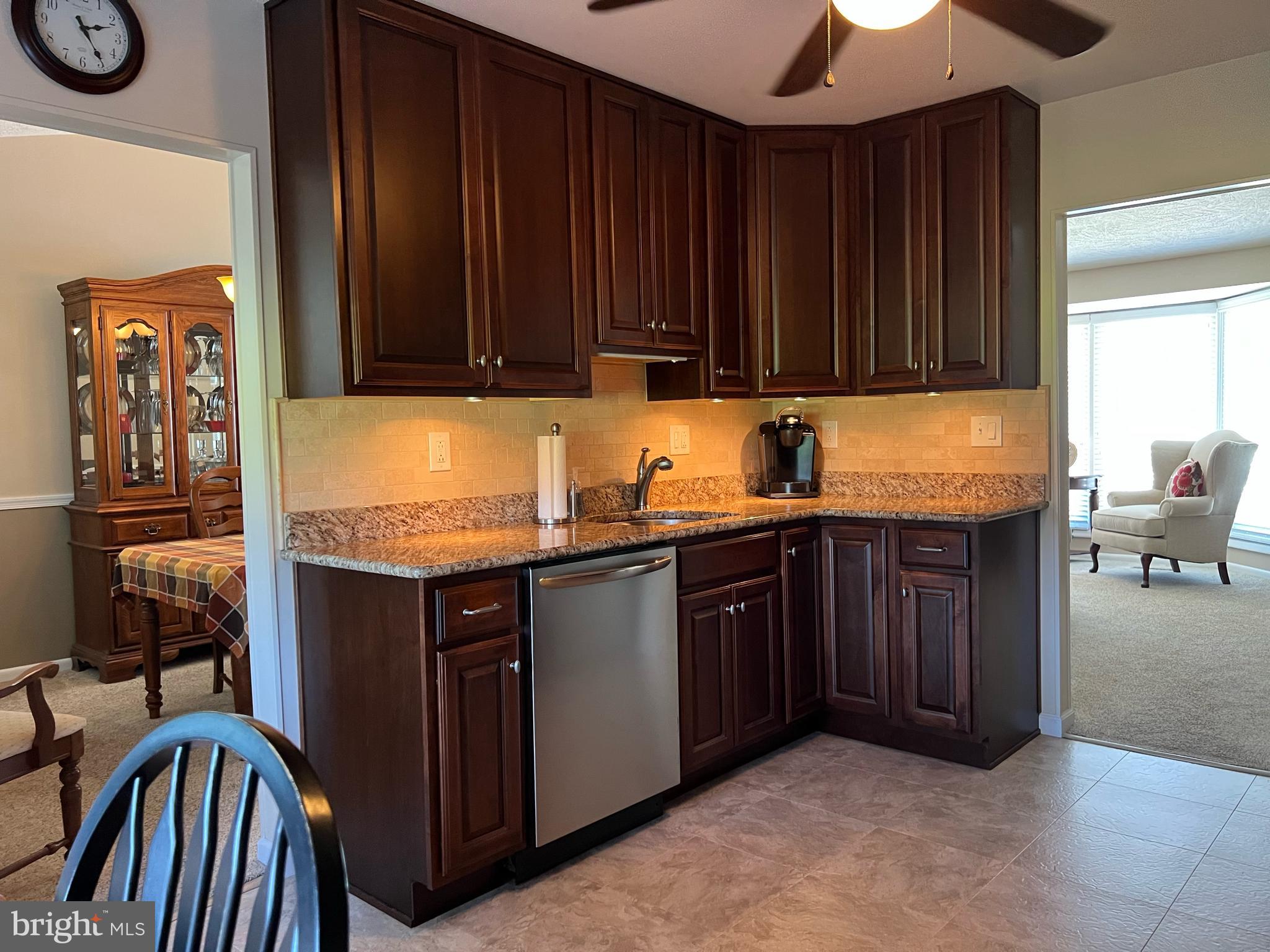 3814 Inwood Lane Philadelphia, PA 19154 - Photo 15 of 37 a kitchen with granite countertop a sink dishwasher stove and cabinets