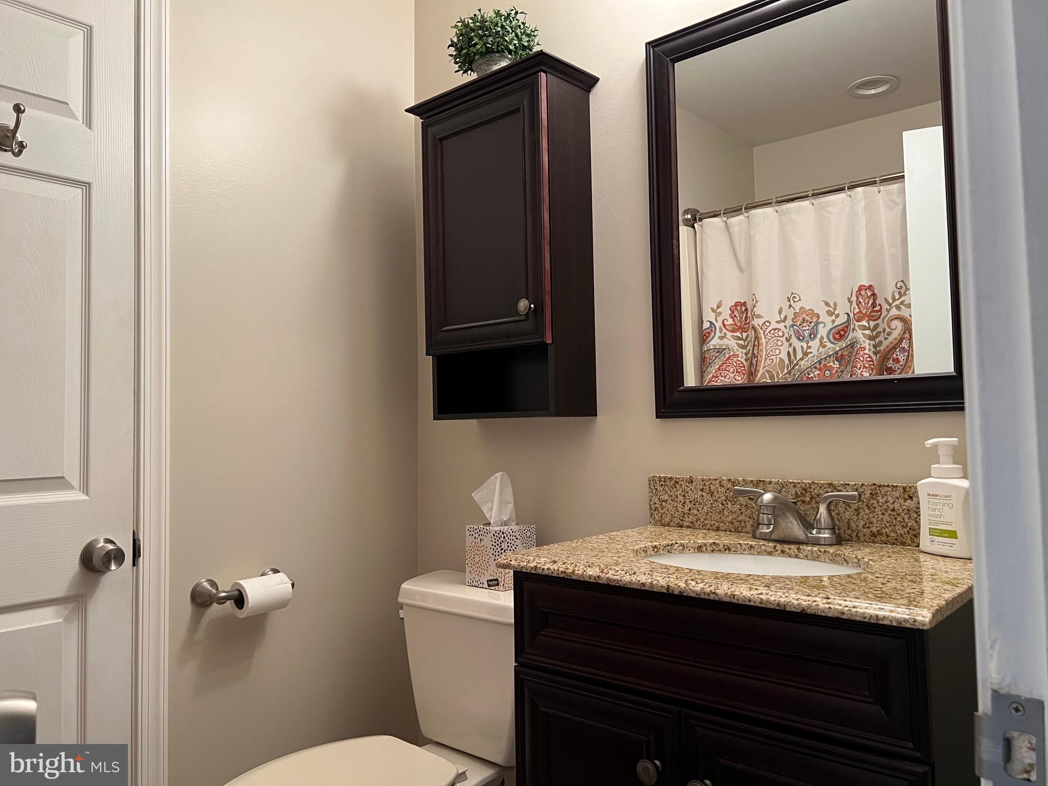 3814 Inwood Lane Philadelphia, PA 19154 - Photo 21 of 37 a bathroom with a granite countertop sink toilet and mirror