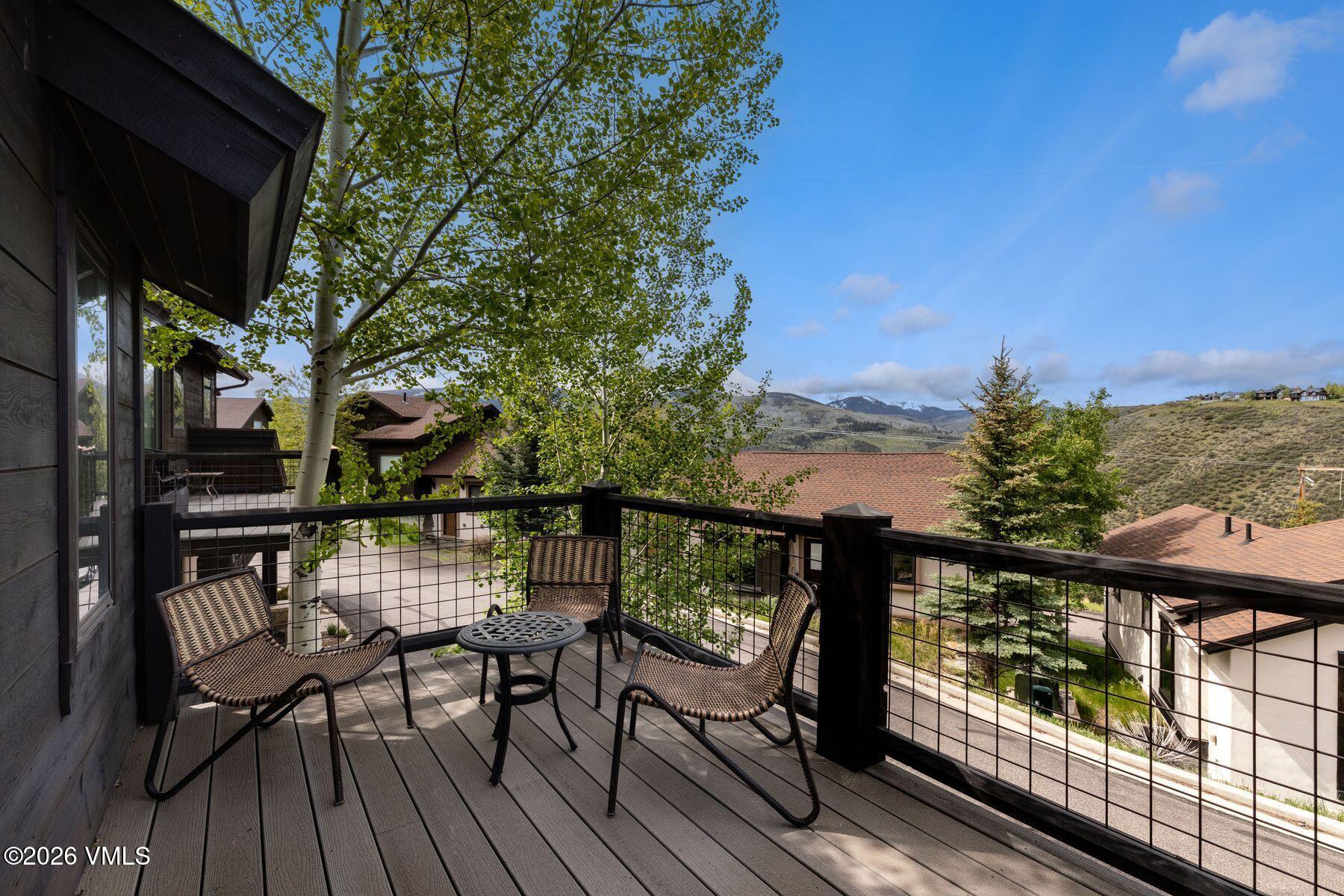 1015 West Wildwood Road, Unit F Avon, CO 81620 - Photo 13 of 35 a view of chairs and table in the balcony