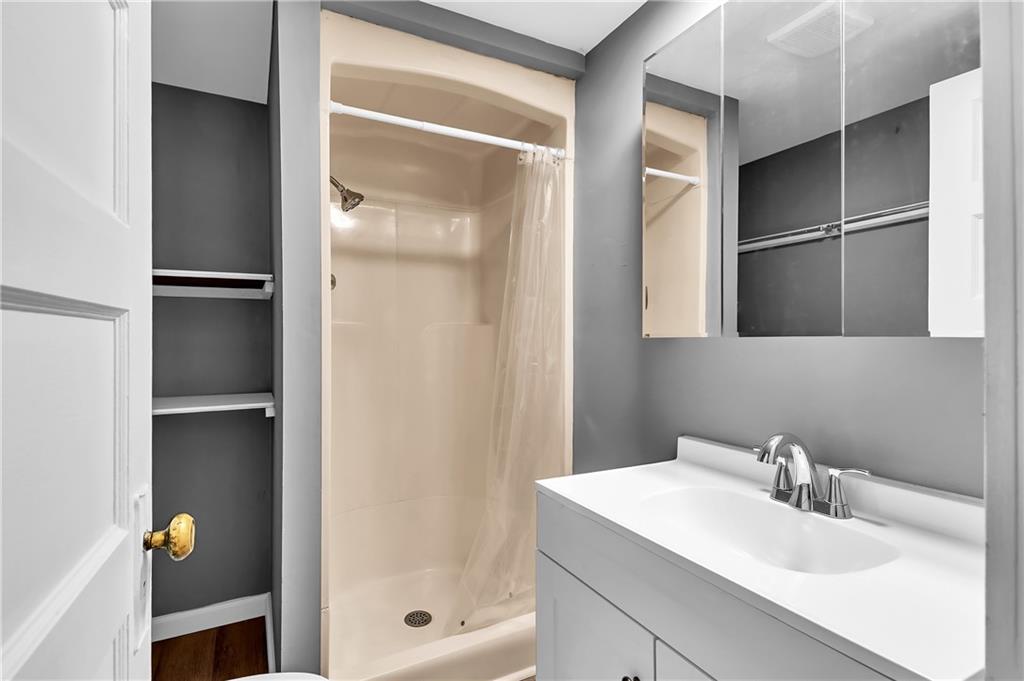 825 Walnut Street Rochester, PA 15074 - Photo 14 of 24 a bathroom with a sink and a shower