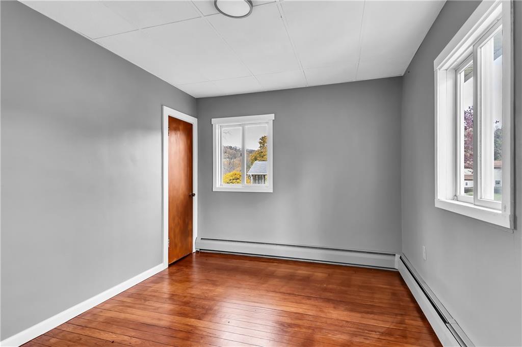 825 Walnut Street Rochester, PA 15074 - Photo 15 of 24 a view of a room with wooden floor and windows