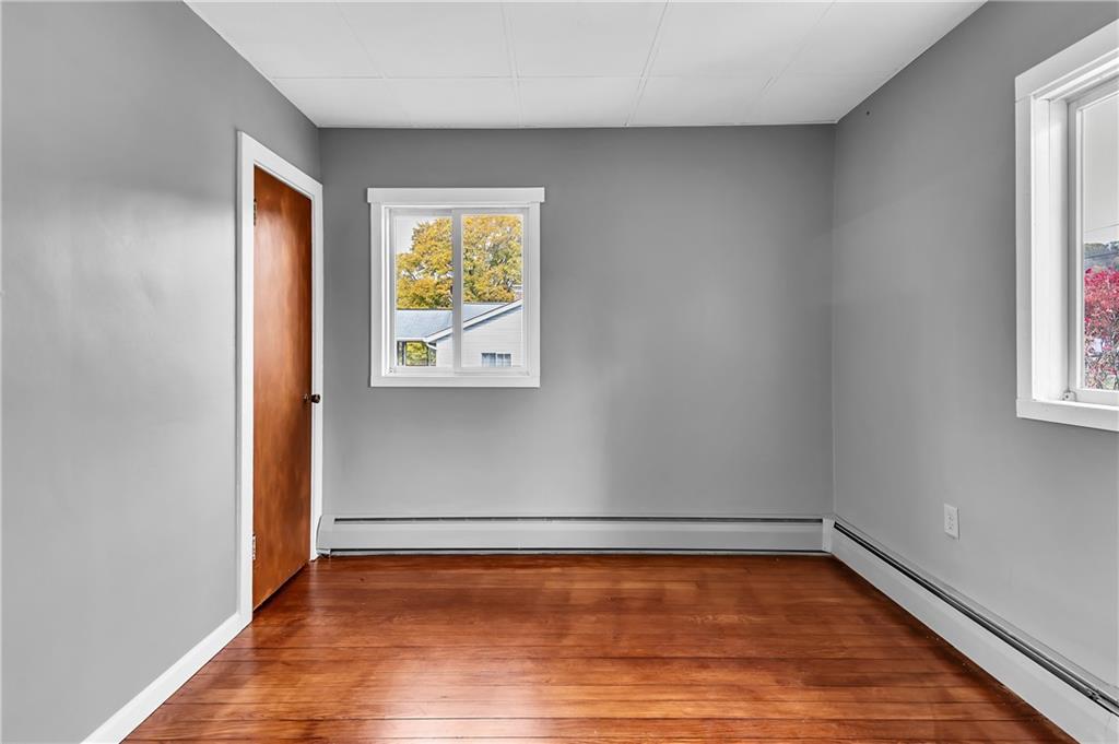 825 Walnut Street Rochester, PA 15074 - Photo 17 of 24 a view of a room with wooden floor and window