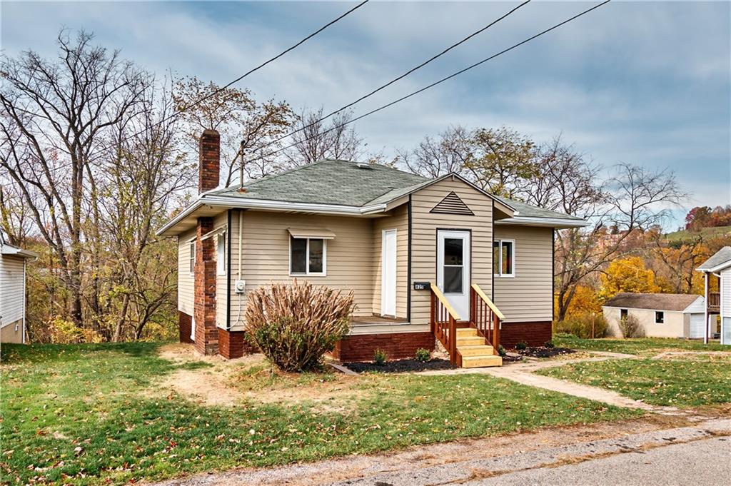 825 Walnut Street Rochester, PA 15074 - Photo 2 of 24 a view of a house with a yard