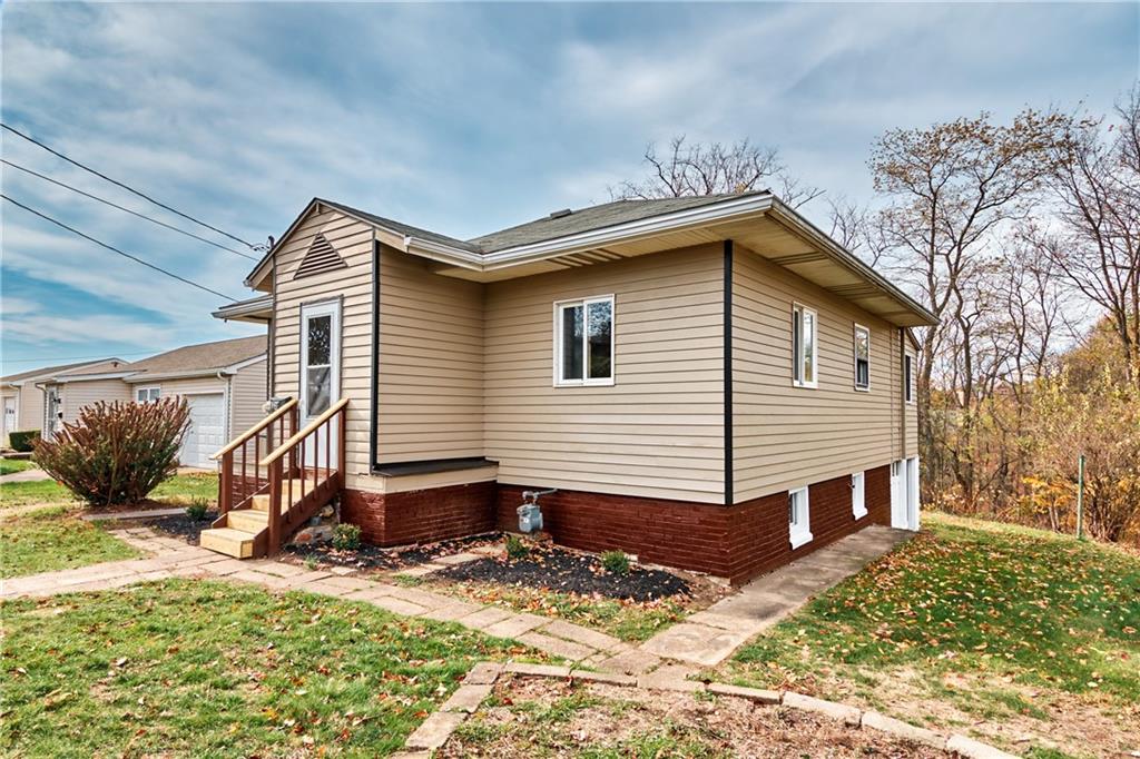 825 Walnut Street Rochester, PA 15074 - Photo 21 of 24 a view of a house with a yard