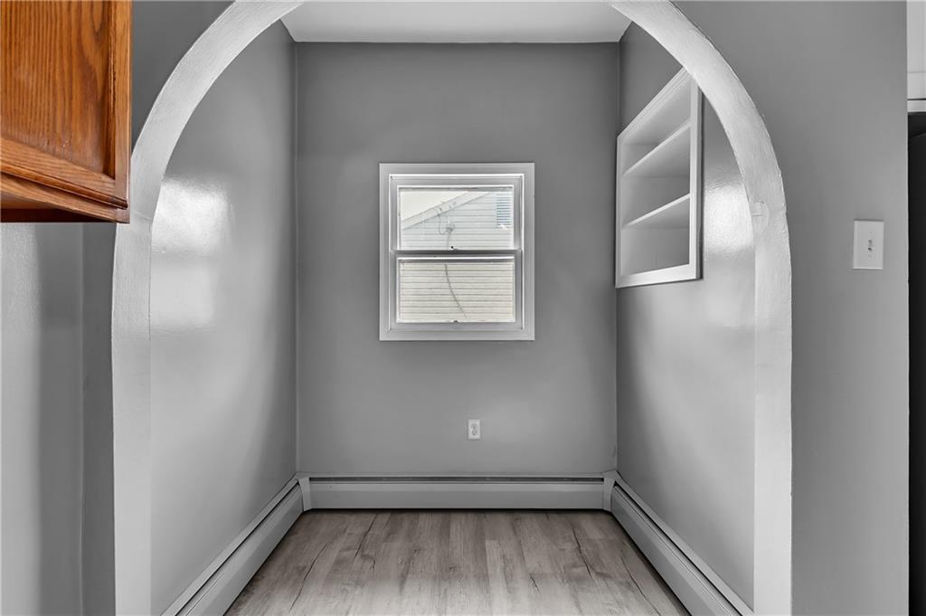 825 Walnut Street Rochester, PA 15074 - Photo 9 of 24 a view of a hallway with wooden floor and closet