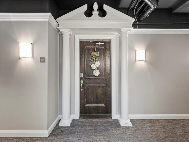 a kitchen with stainless steel appliances granite countertop a sink and a refrigerator