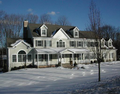57 Old Trolley Road Ridgefield, CT 06877 - Photo 1 of 1 a front view of residential houses with yard