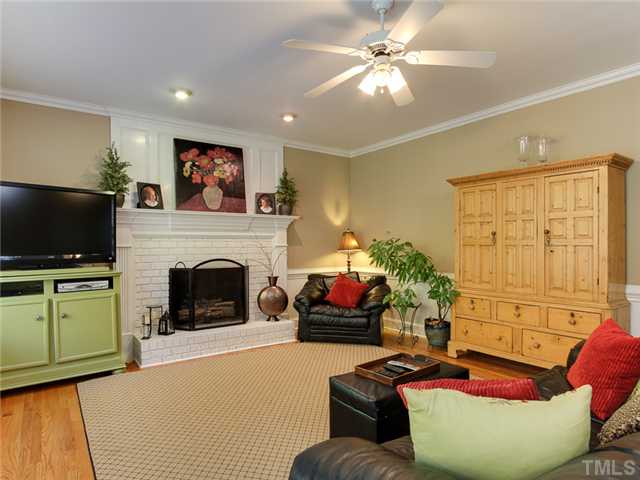 408 Reedham Way Raleigh, NC 27615 - Photo 6 of 25 Another view of family room with wainscoting and lots of wall space for furniture.