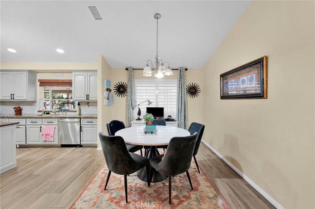 17777 Brazier Drive Riverside, CA 92508 - Photo 12 of 58 a view of a dining room with furniture window and wooden floor