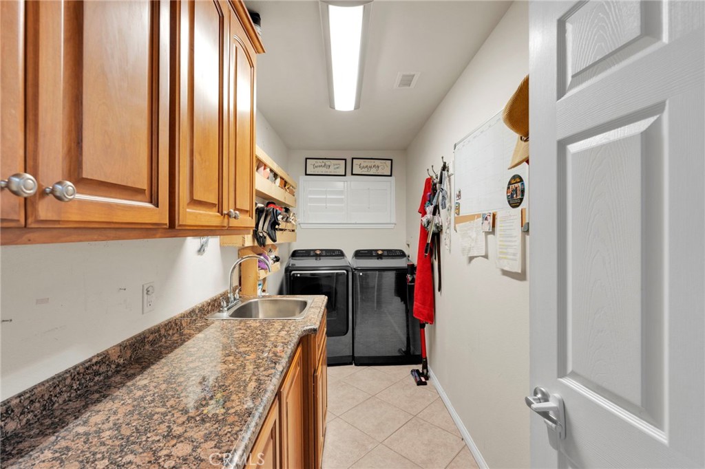 17777 Brazier Drive Riverside, CA 92508 - Photo 24 of 58 a view of a kitchen with a sink