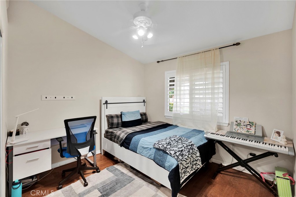 17777 Brazier Drive Riverside, CA 92508 - Photo 25 of 58 a bedroom with a bed and a chandelier