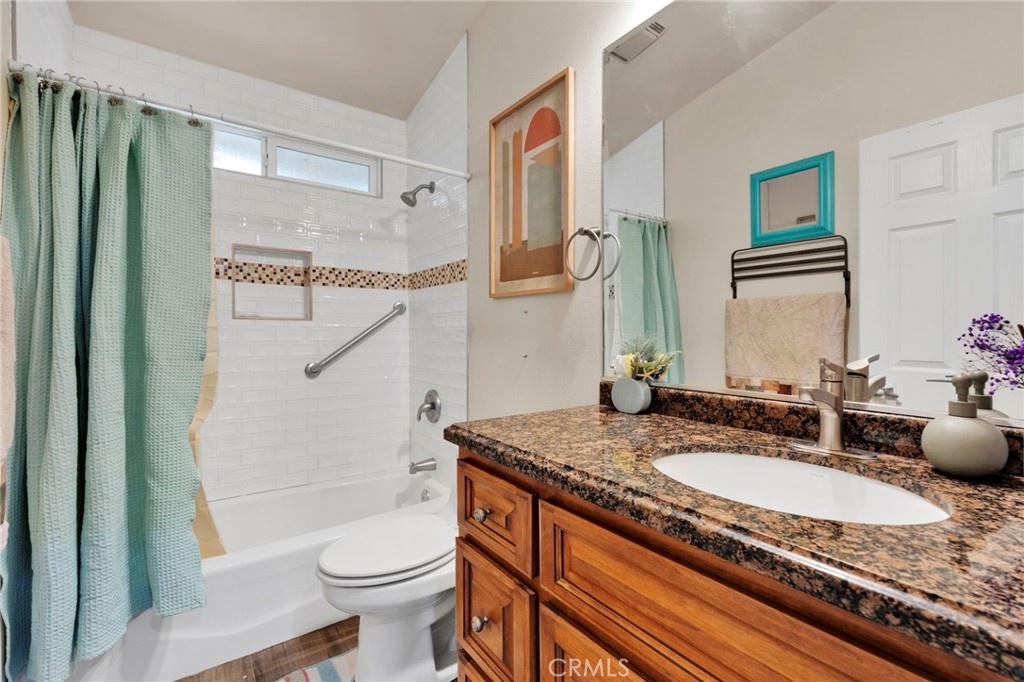 17777 Brazier Drive Riverside, CA 92508 - Photo 28 of 58 a bathroom with a granite countertop sink toilet and shower